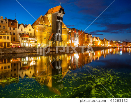 Gdansk Old Town and famous crane on River Motlawa embankment by night, Poland Gdansk Old Town and famous crane on River Motlawa embankment by night, Poland 62265182