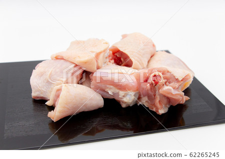 Chopped chicken on a black tray 62265245