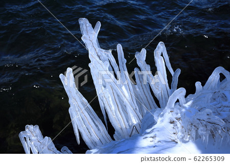 Frozen water spray at Lake Chuzenji in winter at Utagahama 62265309