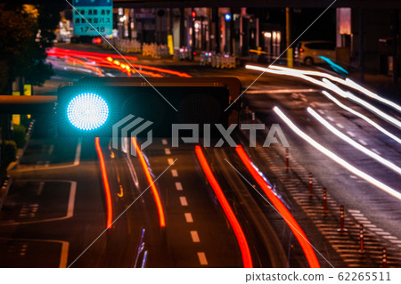 Traffic lights and traffic at night Traffic lights and traffic at night 62265511
