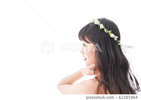 A smiling bride wearing a dress 62265864