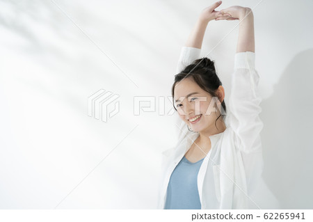 A young lady stretching out 62265941