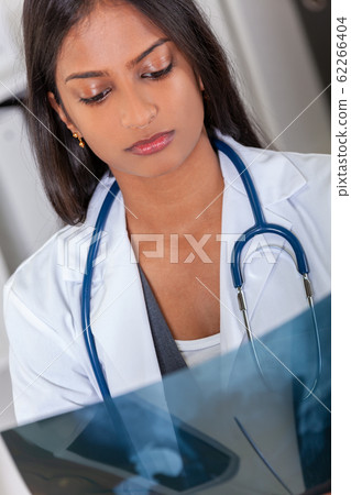 Asian Indian Female Woman Hospital Doctor Looking at an X-Ray 62266404
