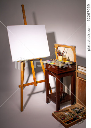 Oil painting. Blank canvas on Easel. Palette Stock Photo