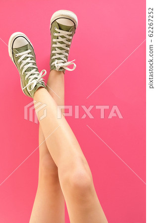 Young Woman Legs In Shoes Sneakers 62267252