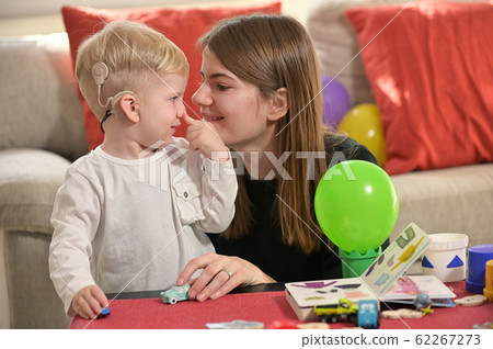 A Boy With A Hearing Aids And Cochlear Implants 62267273