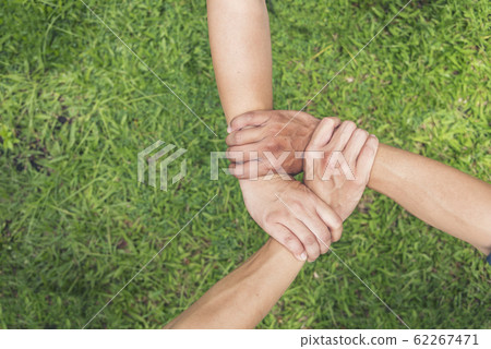 Authentic triangle partners hands together 62267471