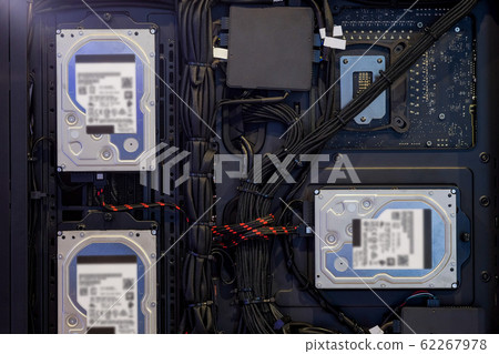 Close-up 3.5-inch Hard Disk Drive that installed for storage data and cable wire is neatly stored on back view of computer PC case, inside and D.I.Y. Computer PC technic Close-up 3.5-inch Hard Disk Drive that installed for storage data and cable wire is neatly stored on back view of computer PC case, inside and D.I.Y. Computer PC technic 62267978
