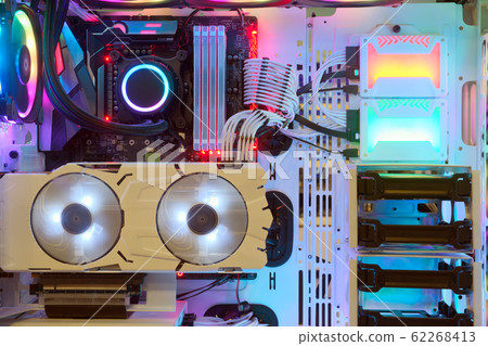 Close-up and inside Desktop PC Gaming and Cooling Fan CPU with multicolored LED RGB light show status on working mode, interior PC case technology background Close-up and inside Desktop PC Gaming and Cooling Fan CPU with multicolored LED RGB light show status on working mode, interior PC case technology background 62268413