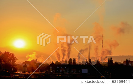 Dark smoke from chimney in factory. Air pollution in city Ruzomberok, Slovakia 62269444