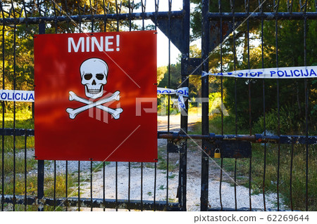 Beware of mines sign on closed territory 62269644