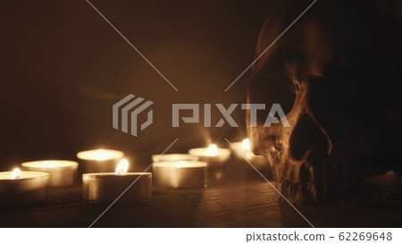 Candles and skull closeup photo Candles and skull closeup photo 62269648