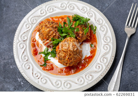 Meatballs with tomato sauce and parsley. Meatballs with tomato sauce and parsley. 62269831