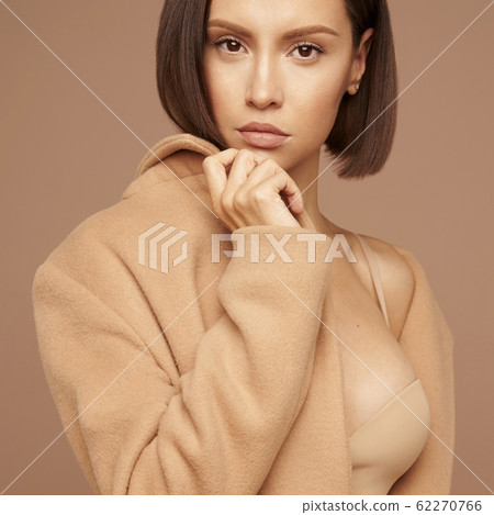 Fashion beautiful lady in beige coat 62270766