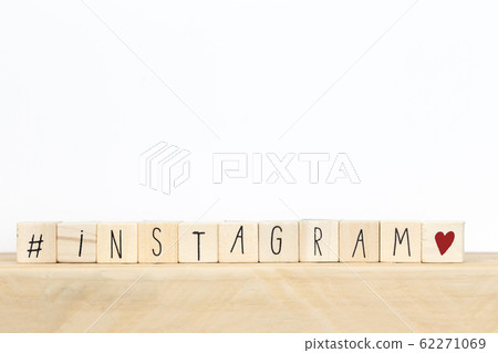 Wooden cubes with a hashtag and the word instagram, social media concept background Wooden cubes with a hashtag and the word instagram, social media concept background 62271069