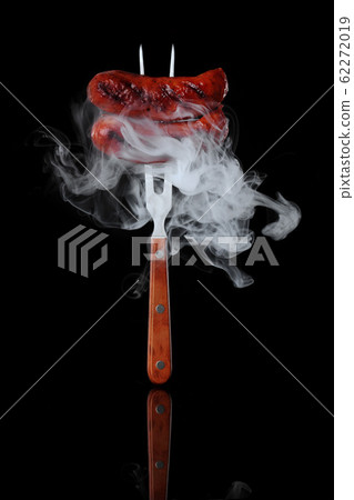 Grilled sausage. Pinned to fork.With smoke.On 62272019