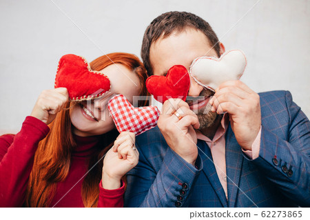 Valentine's Day. Couple with heart symbols. 62273865