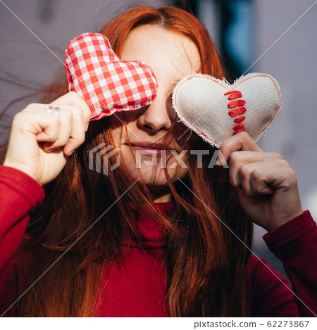 Valentine's Day. Pretty girl with heart symbols 62273867