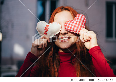 Valentine's Day. Pretty girl with heart symbols Valentine's Day. Pretty girl with heart symbols 62273868