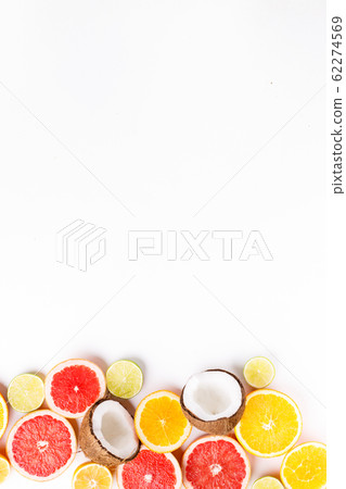 Summertime creative layout with exotic fruits Summertime creative layout with exotic fruits 62274569