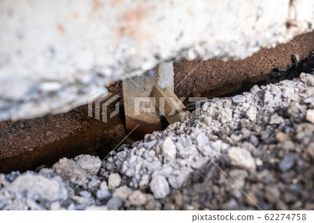 Concrete piles foundation under house in a subsidence area Concrete piles foundation under house in a subsidence area 62274758