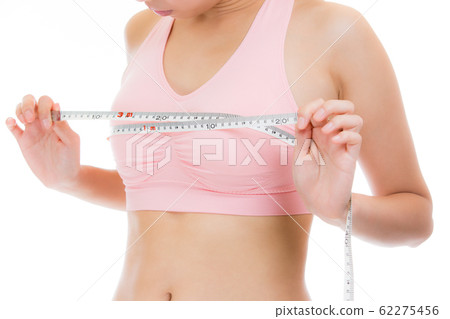 Woman measuring bust with measure Woman measuring bust with measure 62275456