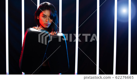 Girl exercises in Modern Neon Boxing Gym heavily Girl exercises in Modern Neon Boxing Gym heavily 62276665