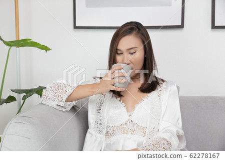The girl hold a cup of tea The girl hold a cup of tea 62278167