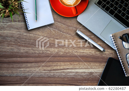 Office stuff with Movie clapper tablet, laptop ,smartphone and coffee cup notepad top view shot. 62280487