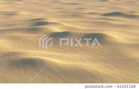 Brown sand on beach with bumps under sunlight 62281186