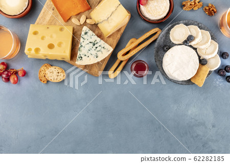 Cheese design template. Blue cheese, Brie, Dutch cheese and others, overhead shot with copy space 62282185