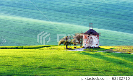 Picturesque rural landscape with old windmill 62282710