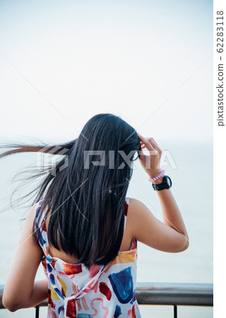 Woman relax at sea viewpoint in concept travel Woman relax at sea viewpoint in concept travel 62283118