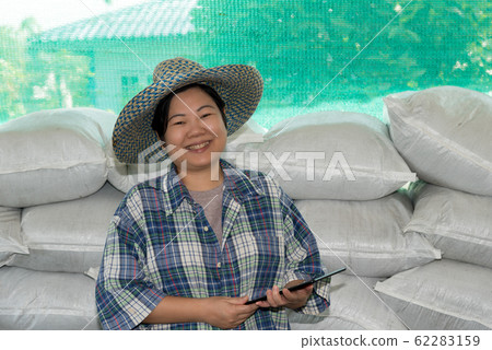 Smart farmer agriculturist with Organic Fertilizer Smart farmer agriculturist with Organic Fertilizer 62283159