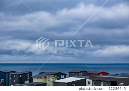 Typical modern house roofs near ocean in Faroe Islands 62286643