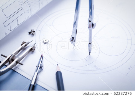 Compass drawing a circle on the drawing 62287276