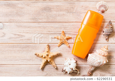 Top view of sunscreen bottle with starfish on Top view of sunscreen bottle with starfish on 62290531