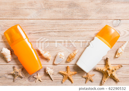 Sunscreen bottles with seashells and starfish on Sunscreen bottles with seashells and starfish on 62290532