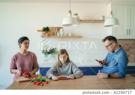Unhappy married couple and small child at home. Angry wife and husband quarreling arguing, sad frustrated little daughter suffers in the middle. Break up divorce concept Unhappy married couple and small child at home. Angry wife and husband quarreling arguing, sad frustrated little daughter suffers in the middle. Break up divorce concept 62290717