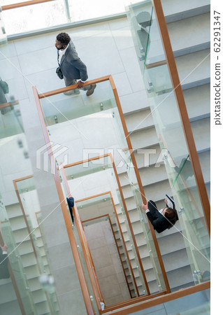 Business people in stairway of office center 62291347