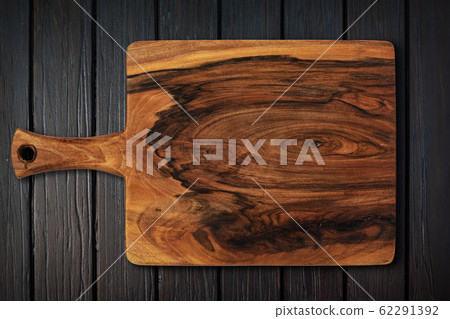 cutting board on a wooden table 62291392