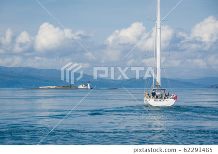 Sailing yacht cruising at Hebrides islands Sailing yacht cruising at Hebrides islands 62291485