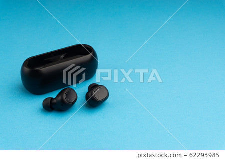 Wireless earbuds or earphones on blue background 62293985