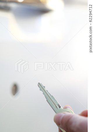 Key (duplicate key spare key passenger car rental car body parts faceless slide door person transfer senior) 62294712