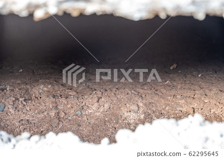 Subsidence under a house caused by a broken water service pipe 62295645