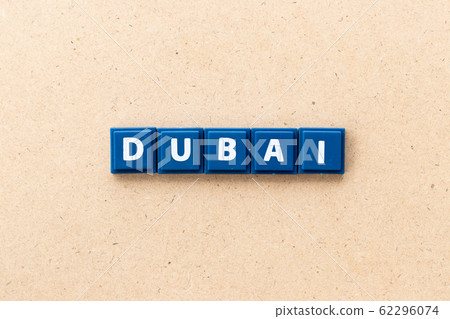 Tile letter in word Dubai on wood background Tile letter in word Dubai on wood background 62296074