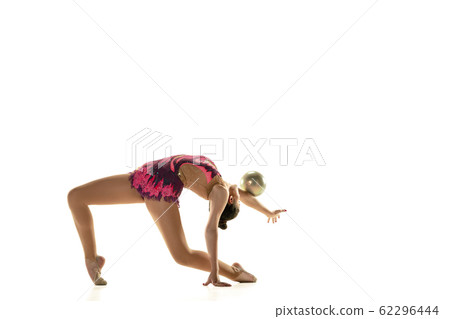 Young flexible female gymnast isolated on white studio background Young flexible female gymnast isolated on white studio background 62296444