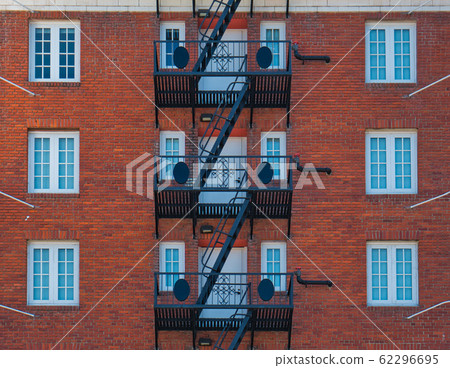Brick facade with black steel emergency staircase Brick facade with black steel emergency staircase 62296695