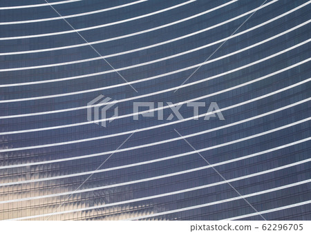 Glass facade of high-rise building with reflection Glass facade of high-rise building with reflection 62296705