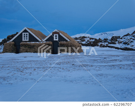 Small wooden houses with a thick wall of peat Small wooden houses with a thick wall of peat 62296707